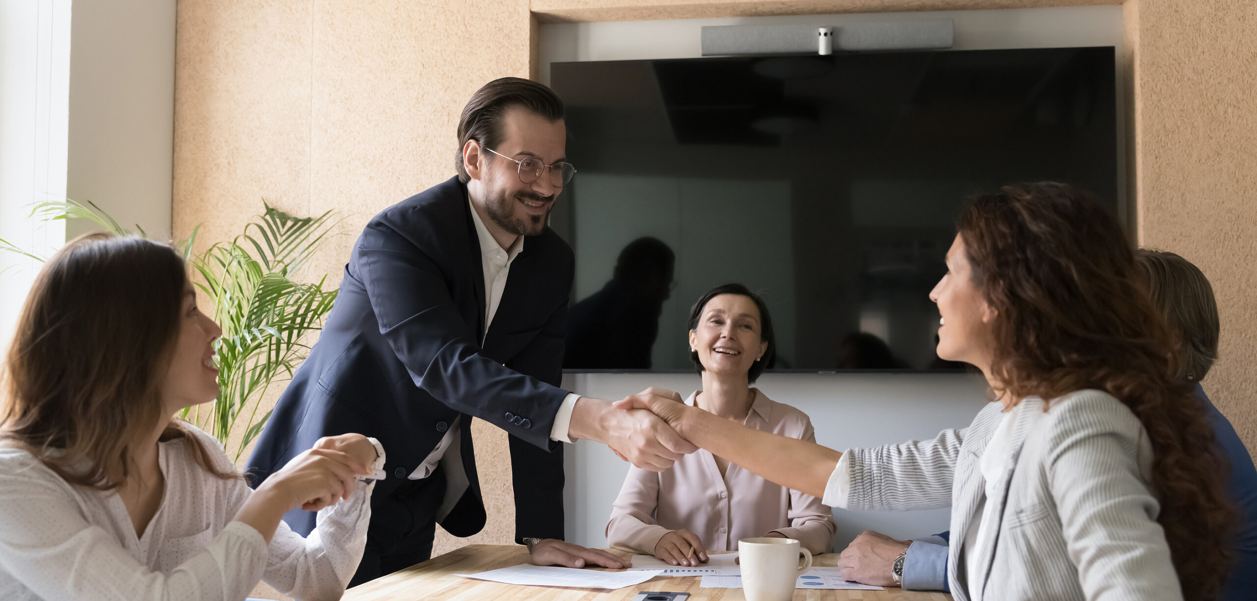 Happy Business Partners Shake Hands After Reached Agreement
